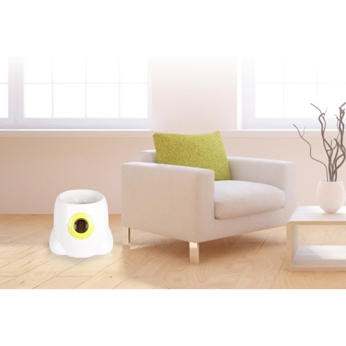 Everyday Essentials™ Ball Launcher beside a modern chair in a bright, tidy living room setting.