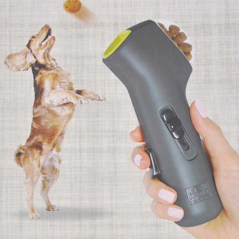 Everyday Essentials™ Pet Treat Launcher in hand, launching treats for a jumping dog.